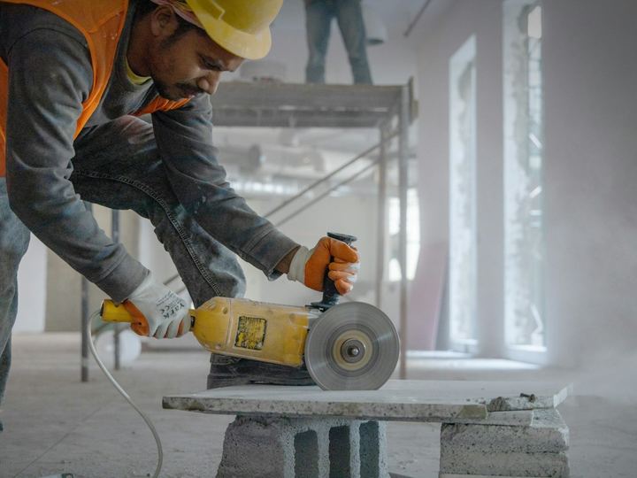 Cut-off saw cutting through a concrete block